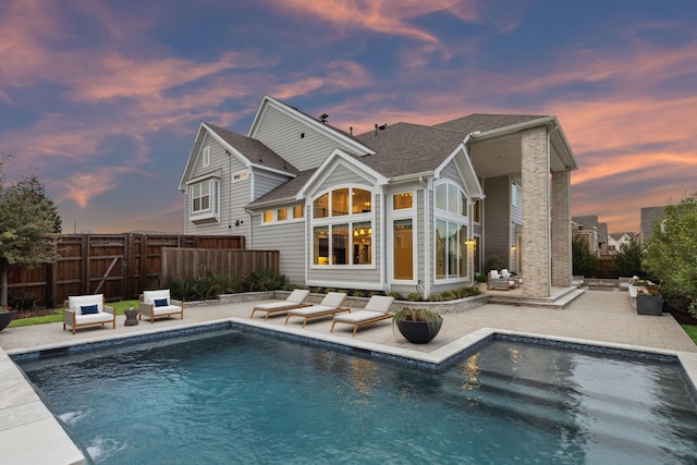 1609 Colonnade Ct, Mckinney, TX 75069 - back of property with a patio, fence, and a shingled roof
