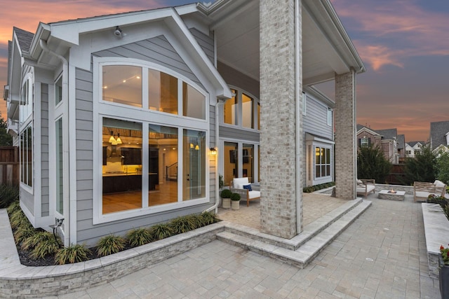 1609 Colonnade Ct, Mckinney, TX 75069 - rear view of house featuring a fire pit and a patio area