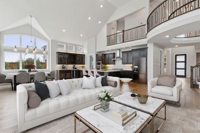1609 Colonnade Ct, Mckinney, TX 75069 - living room with high vaulted ceiling, light wood-style floors, and recessed lighting