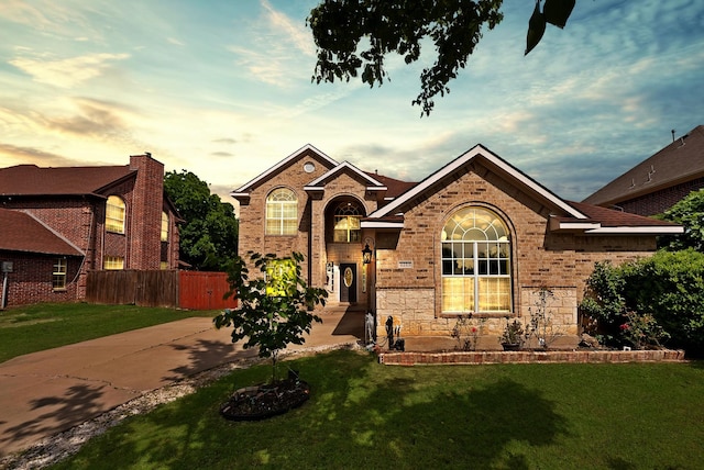 traditional-style home featuring brick siding