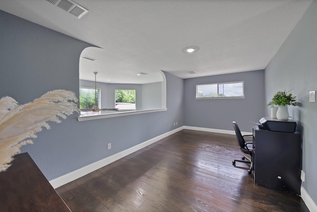 office space featuring wood finished floors and baseboards