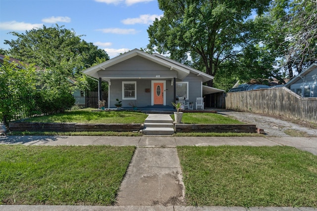 1217 Hawthorne Ave, Fort Worth, TX 76110 - view of front of house featuring concrete driveway, a porch, and a carport