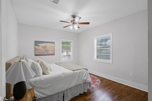 1217 Hawthorne Ave, Fort Worth, TX 76110 - bedroom with baseboards, dark wood-style floors, and a ceiling fan