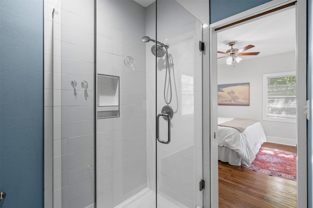 1217 Hawthorne Ave, Fort Worth, TX 76110 - ensuite bathroom featuring a stall shower, wood finished floors, and a ceiling fan