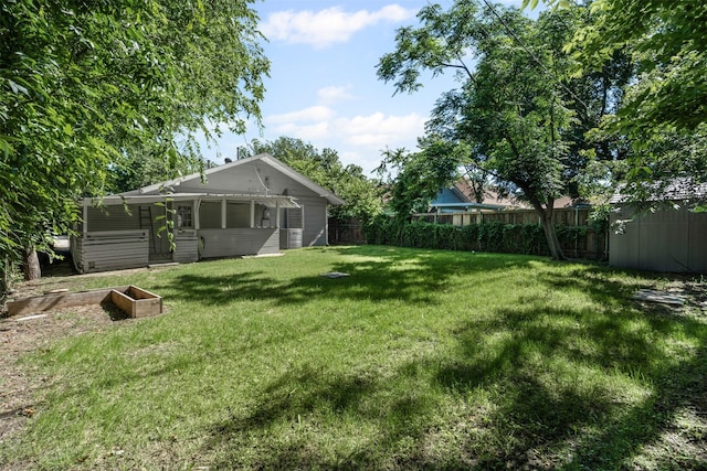 1217 Hawthorne Ave, Fort Worth, TX 76110 - view of yard with a sunroom and a vegetable garden