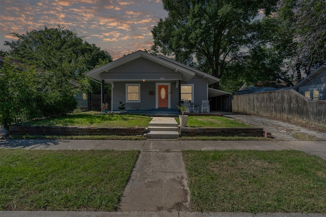 1217 Hawthorne Ave, Fort Worth, TX 76110 - bungalow with driveway, covered porch, and an attached carport