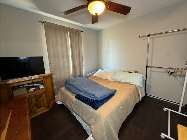 1400 Royal Ln, Cisco, TX 76437 - bedroom with dark wood-type flooring and a ceiling fan