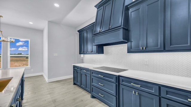 140 Rolling Hills Blvd, Alvord, TX 76225 - kitchen featuring blue cabinets, baseboards, decorative backsplash, and recessed lighting