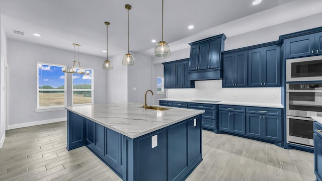 140 Rolling Hills Blvd, Alvord, TX 76225 - kitchen with a sink, stainless steel appliances, blue cabinets, light stone counters, and recessed lighting