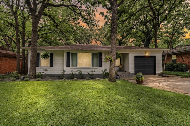 1404 Bluebonnet Trl, Arlington, TX 76013 - single story home with a garage, concrete driveway, brick siding, and a lawn
