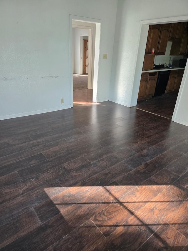 811 Vincent St, Brownwood, TX 76801 - unfurnished room with dark wood finished floors and baseboards