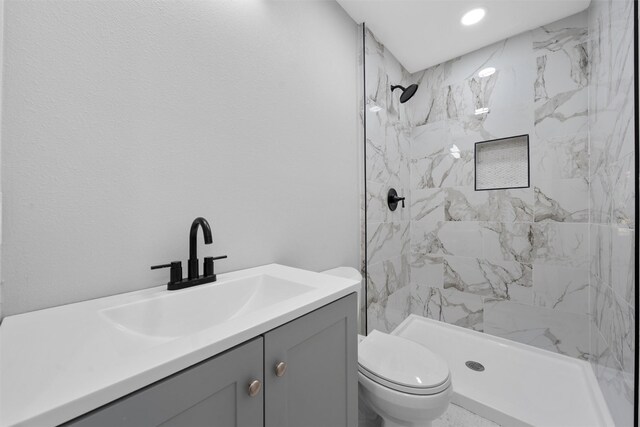 2208 Jane St, Waco, TX 76711 - full bathroom with toilet, a tile shower, vanity, and recessed lighting
