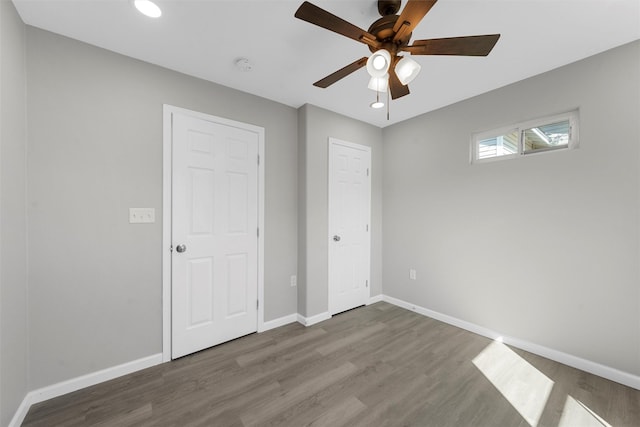 2208 Jane St, Waco, TX 76711 - unfurnished bedroom with wood finished floors, baseboards, recessed lighting, and a ceiling fan