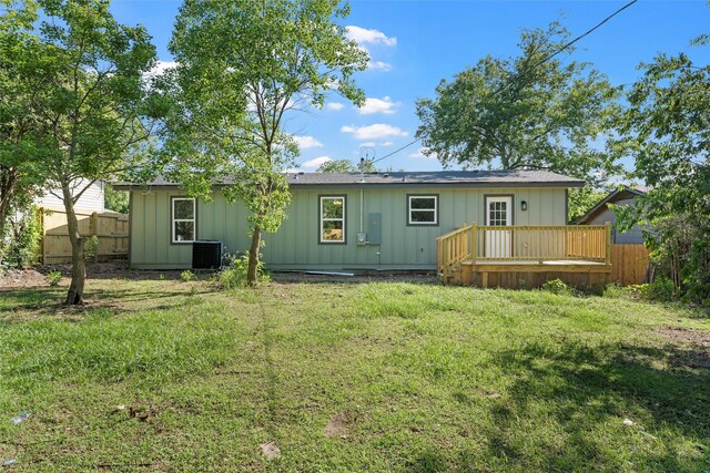 2208 Jane St, Waco, TX 76711 - rear view of property with a deck, board and batten siding, and central AC