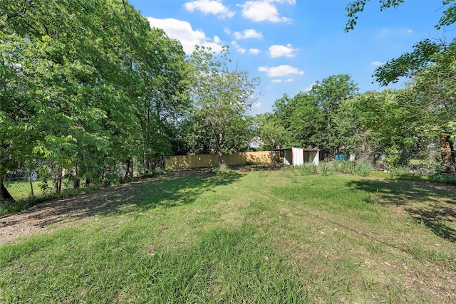 2208 Jane St, Waco, TX 76711 - view of yard with a storage unit and an outbuilding