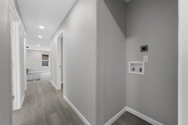 2208 Jane St, Waco, TX 76711 - laundry area with hookup for an electric dryer, washer hookup, wood finished floors, baseboards, and recessed lighting