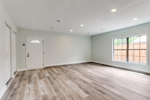 9306 Grant Dr, Rowlett, TX 75088 - foyer with light wood-style floors, recessed lighting, and baseboards