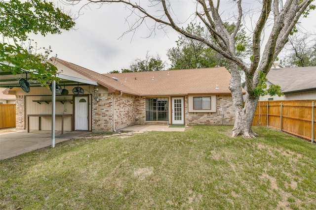 9306 Grant Dr, Rowlett, TX 75088 - rear view of property featuring brick siding, roof with shingles, and a patio