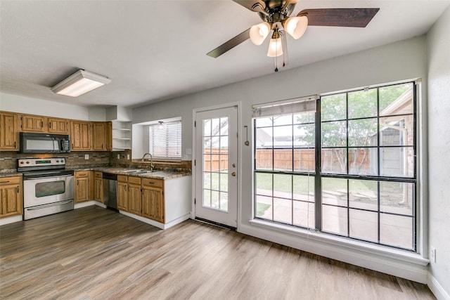 9306 Grant Dr, Rowlett, TX 75088 - spare room with baseboards, dark wood-style flooring, and ceiling fan