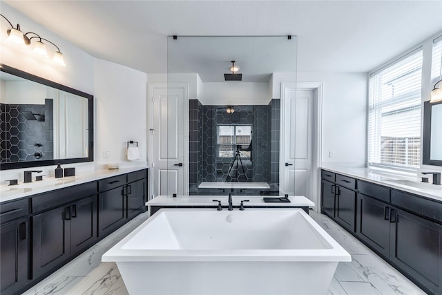 4506 Sky Harbor Dr, Rockwall, TX 75087 - bathroom featuring marble look tile flooring, a tile shower, two vanities, and a soaking tub
