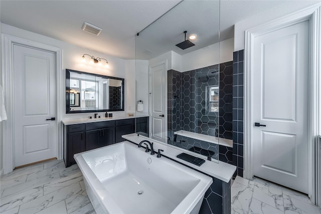 4506 Sky Harbor Dr, Rockwall, TX 75087 - bathroom with marble look tile flooring, tile walls, a walk in shower, and vanity