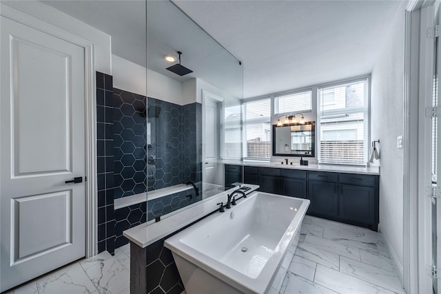 4506 Sky Harbor Dr, Rockwall, TX 75087 - bathroom with marble finish floors, a tile shower, a soaking tub, vanity, and tile walls