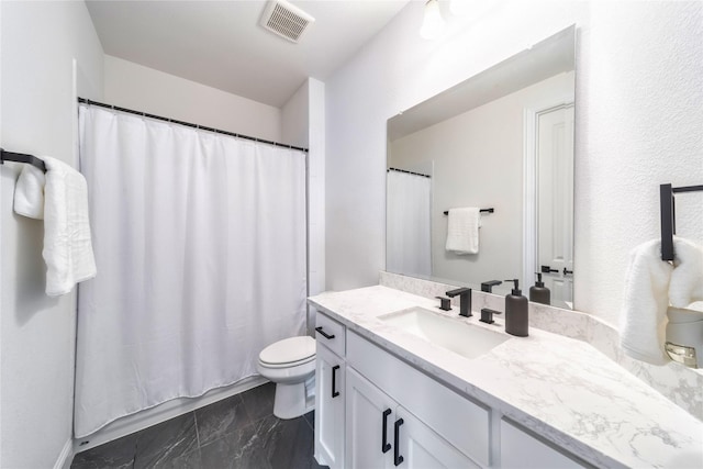 4506 Sky Harbor Dr, Rockwall, TX 75087 - bathroom with marble finish flooring, toilet, and vanity