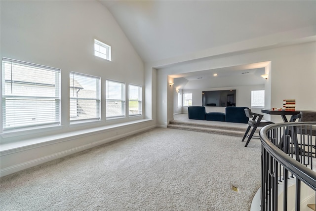 4506 Sky Harbor Dr, Rockwall, TX 75087 - carpeted living area featuring plenty of natural light, baseboards, and high vaulted ceiling