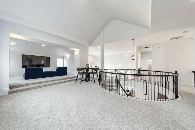 4506 Sky Harbor Dr, Rockwall, TX 75087 - hallway with carpet, lofted ceiling, an upstairs landing, and baseboards
