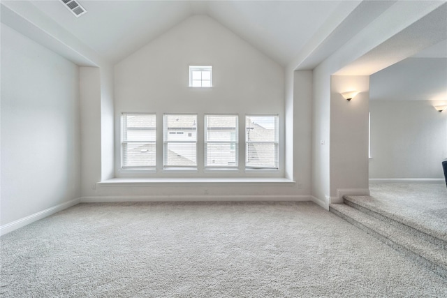 4506 Sky Harbor Dr, Rockwall, TX 75087 - unfurnished living room with carpet floors, baseboards, and high vaulted ceiling