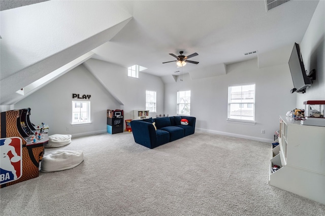 4506 Sky Harbor Dr, Rockwall, TX 75087 - carpeted living area with a ceiling fan, healthy amount of natural light, baseboards, and lofted ceiling