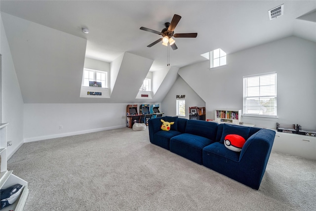 4506 Sky Harbor Dr, Rockwall, TX 75087 - carpeted living area with healthy amount of natural light, lofted ceiling, ceiling fan, and baseboards