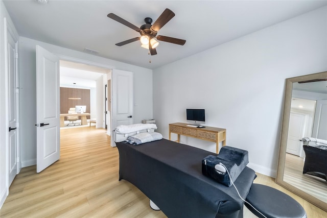 4506 Sky Harbor Dr, Rockwall, TX 75087 - bedroom featuring light wood-type flooring, a desk, baseboards, and ceiling fan