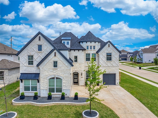 4506 Sky Harbor Dr, Rockwall, TX 75087 - french country inspired facade featuring stone siding, a garage, a front yard, and concrete driveway