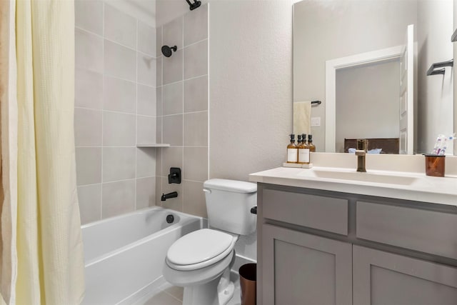 full bathroom featuring toilet, vanity, a textured wall, and shower / bathtub combination with curtain