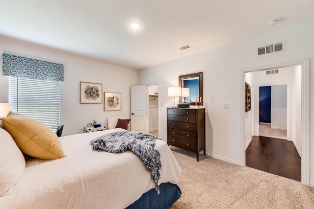 bedroom featuring carpet and baseboards