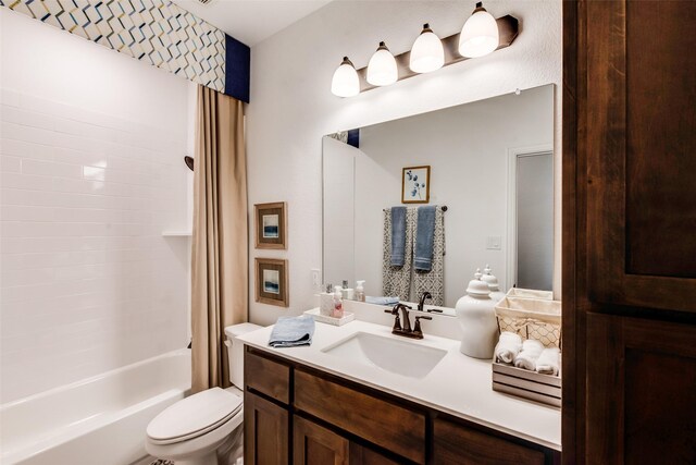 full bath with toilet, shower / tub combo, and vanity