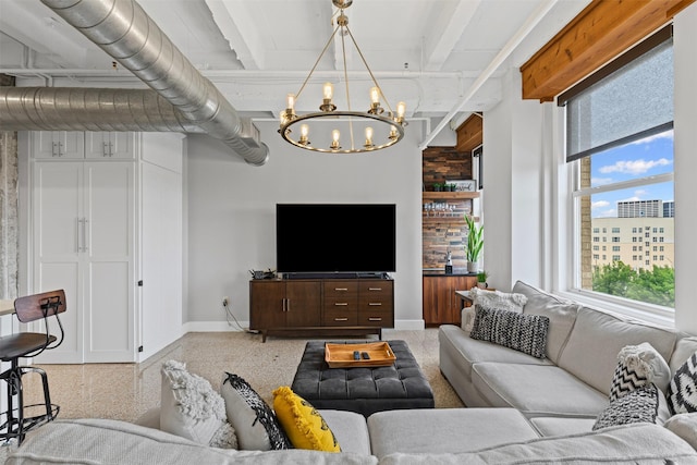 221 W Lancaster Ave Unit 4012, Fort Worth, TX 76102 - living room featuring a chandelier, baseboards, and dark speckled floor