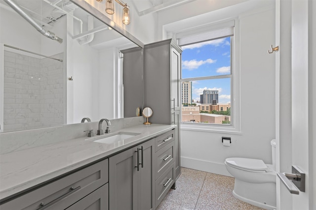 221 W Lancaster Ave Unit 4012, Fort Worth, TX 76102 - bathroom with toilet, baseboards, vanity, and a view of city