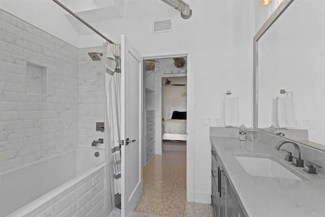 221 W Lancaster Ave Unit 4012, Fort Worth, TX 76102 - full bath with ensuite bathroom, vanity, shower / bath combo, baseboards, and speckle patterned floor