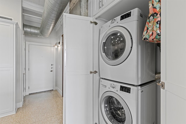 221 W Lancaster Ave Unit 4012, Fort Worth, TX 76102 - laundry room with stacked washer / dryer and baseboards