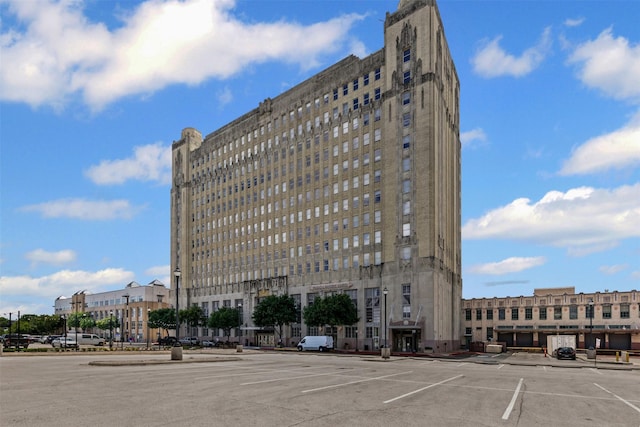 221 W Lancaster Ave Unit 4012, Fort Worth, TX 76102 - view of building exterior featuring uncovered parking