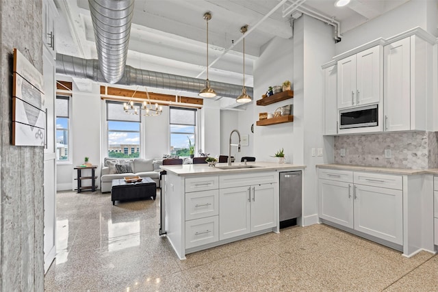 221 W Lancaster Ave Unit 4012, Fort Worth, TX 76102 - kitchen with a sink, stainless steel appliances, white cabinets, a peninsula, and open shelves