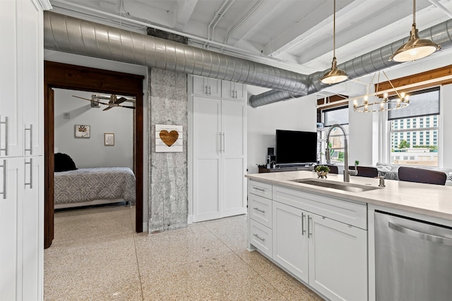 221 W Lancaster Ave Unit 4012, Fort Worth, TX 76102 - kitchen featuring stainless steel dishwasher, a sink, dark aggregate flooring, white cabinetry, and a chandelier