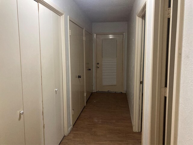 12735 County Road 2922, Eustace, TX 75124 - hallway featuring light wood-type flooring and a textured ceiling
