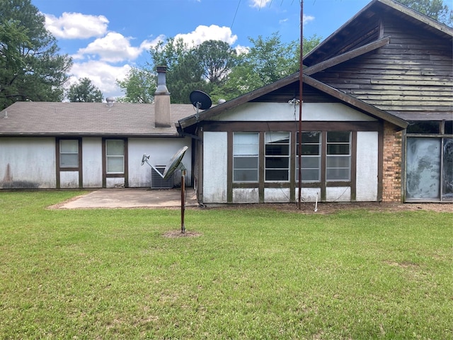 12735 County Road 2922, Eustace, TX 75124 - rear view of house with a patio area and a yard