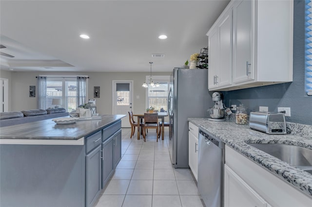 2208 Heaton St, Forney, TX 75126 - kitchen featuring dishwasher, open floor plan, plenty of natural light, white cabinets, and recessed lighting