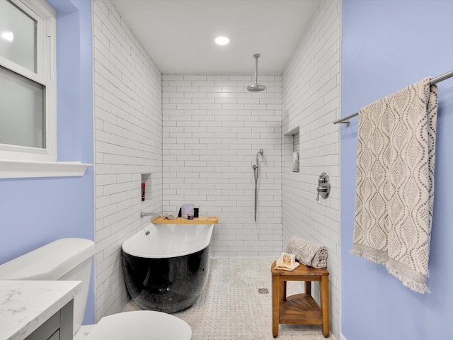 full bath with toilet, tiled shower, a freestanding tub, recessed lighting, and vanity