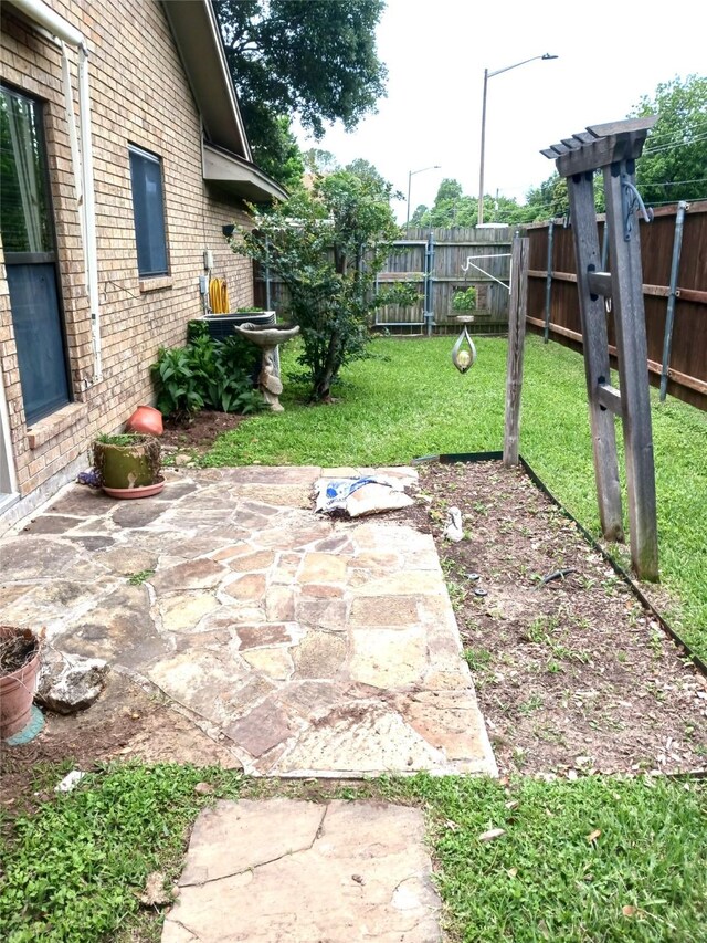 2435 St Gregory St, Arlington, TX 76013 - view of yard featuring a patio