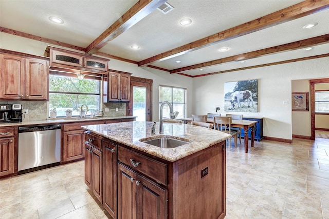 kitchen featuring dishwasher, a sink, backsplash, a kitchen island with sink, and beam ceiling